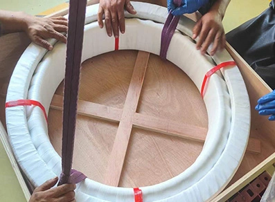 Loading large bearings into wooden boxes